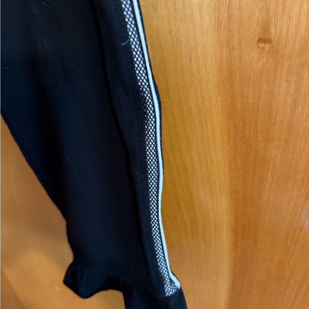Betsey Johnson Black Ankle Pants with Silver and White trim with ruffle.
